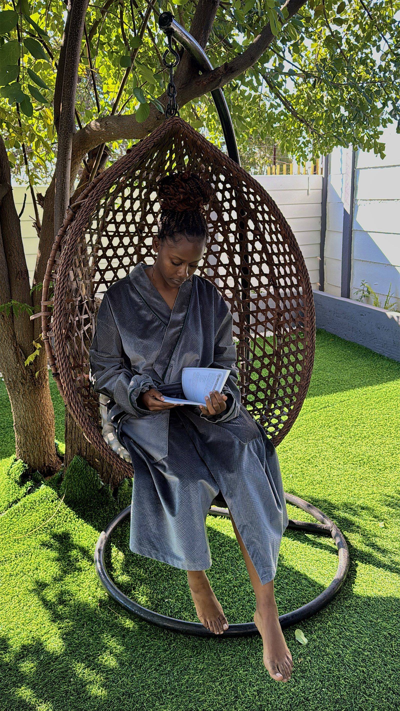Reading in the hanging egg chair