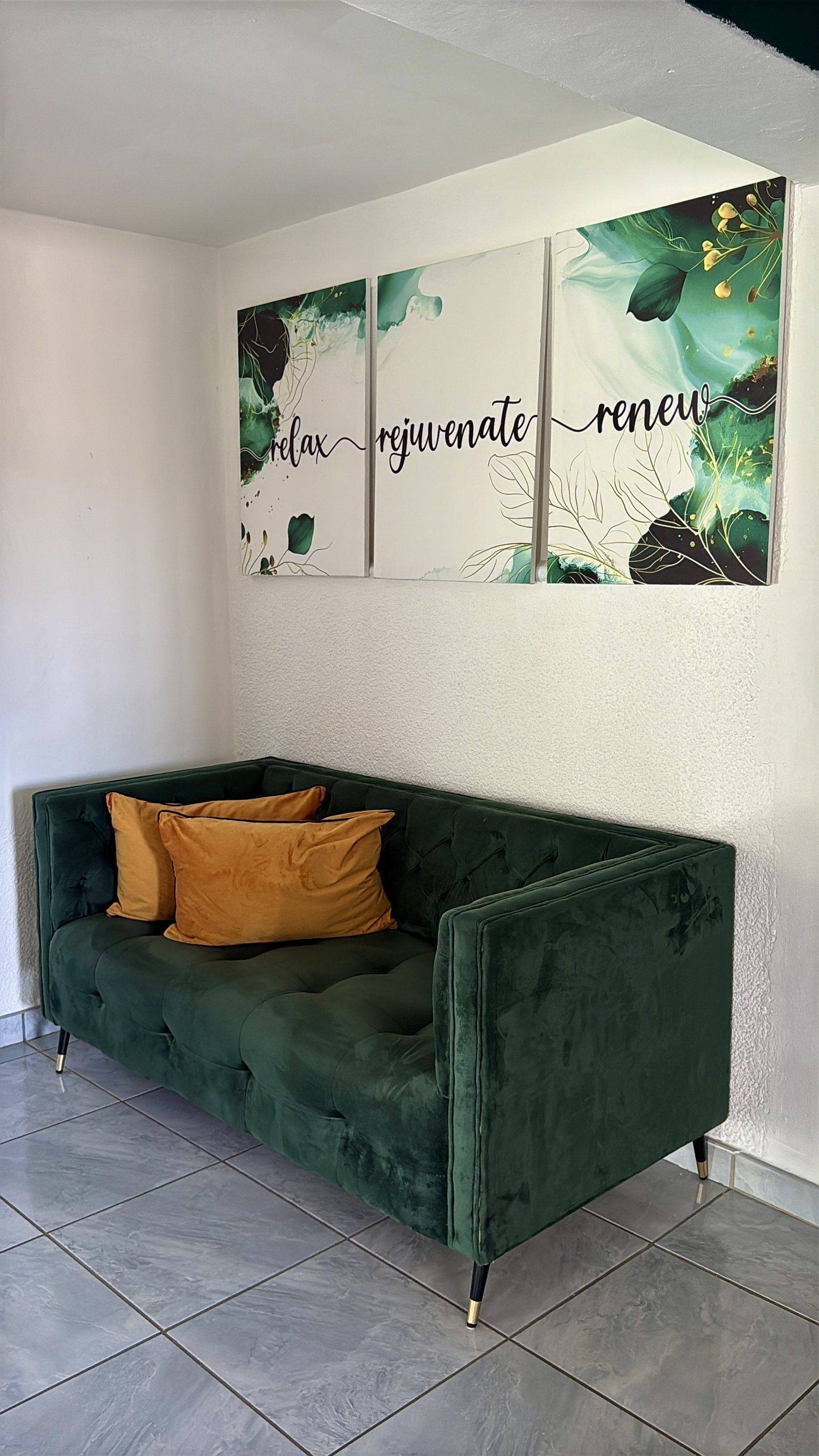 Green velvet sofa in the reception lounge