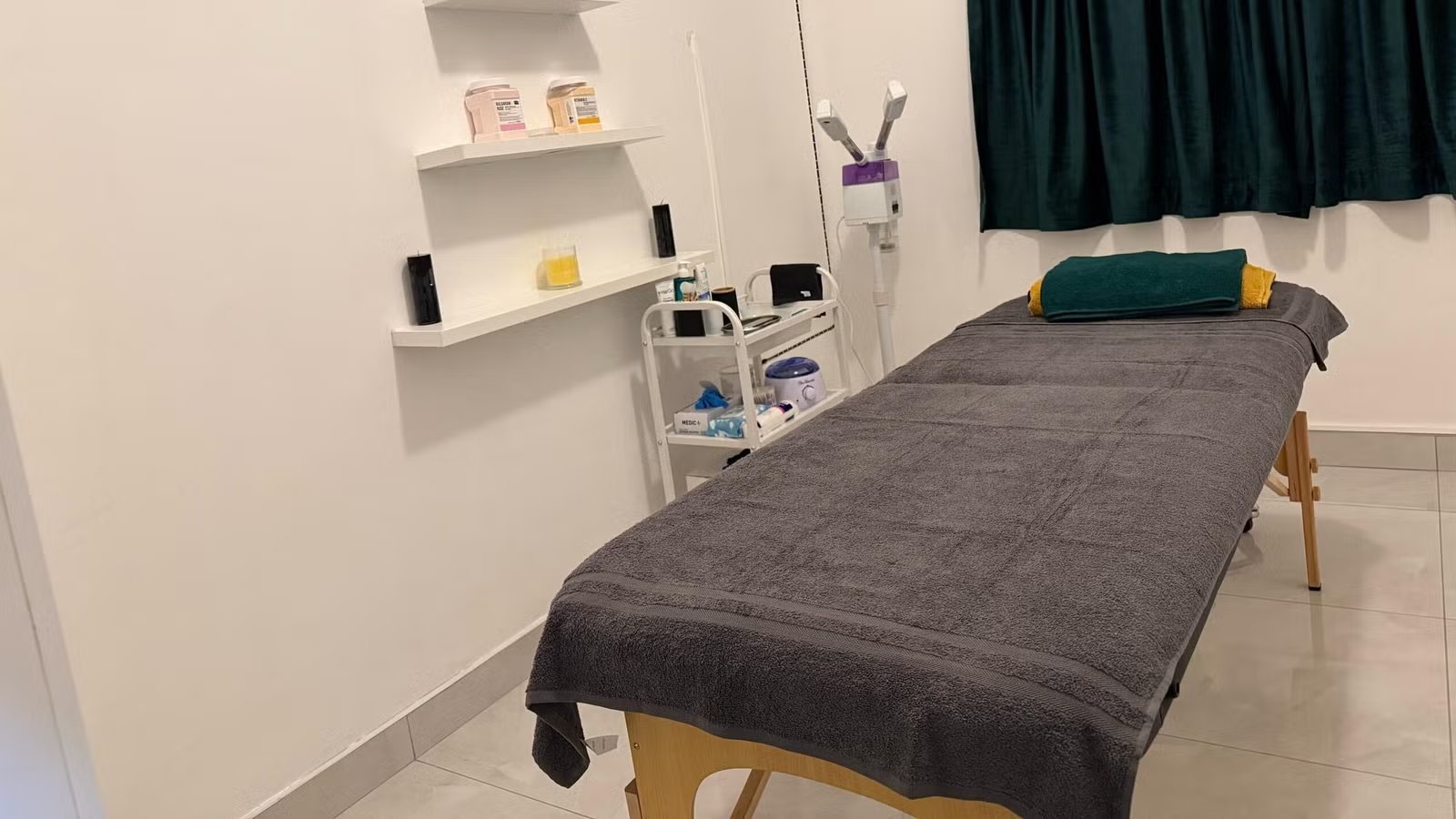 Massage bed and product shelves