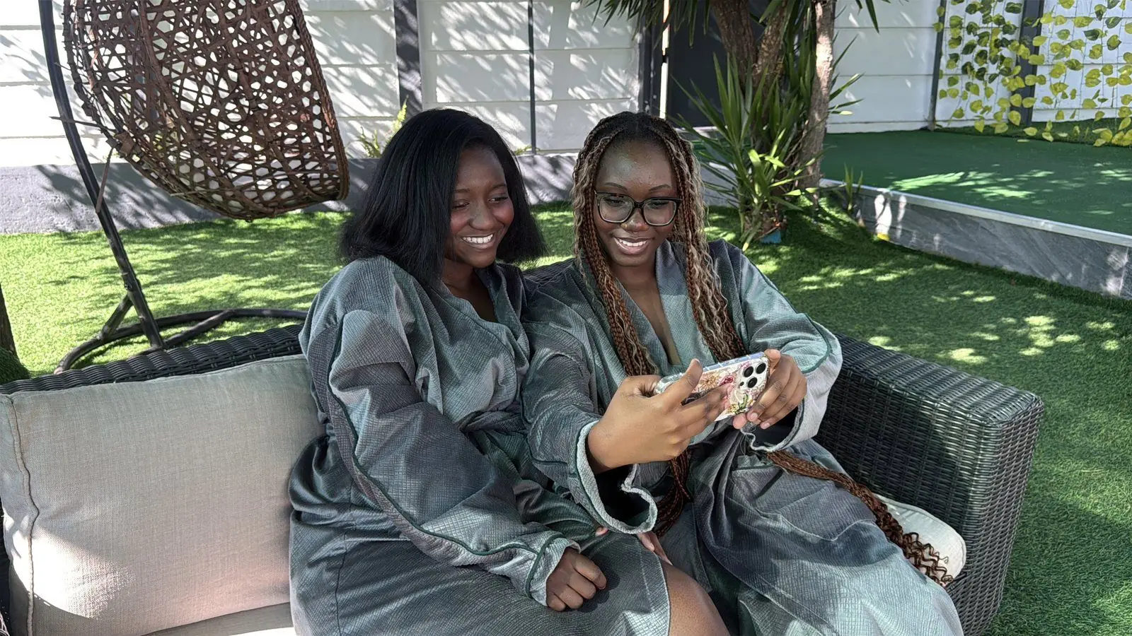 Guests in robes on the garden lounge